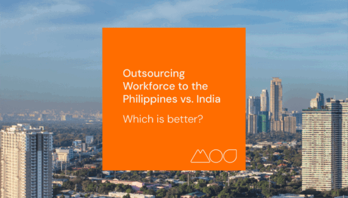 A vivid orange square displays the text: Outsourcing to the Philippines vs. India: Which is better? set against a cityscape of towering buildings under a clear blue sky and a far-off urban skyline.